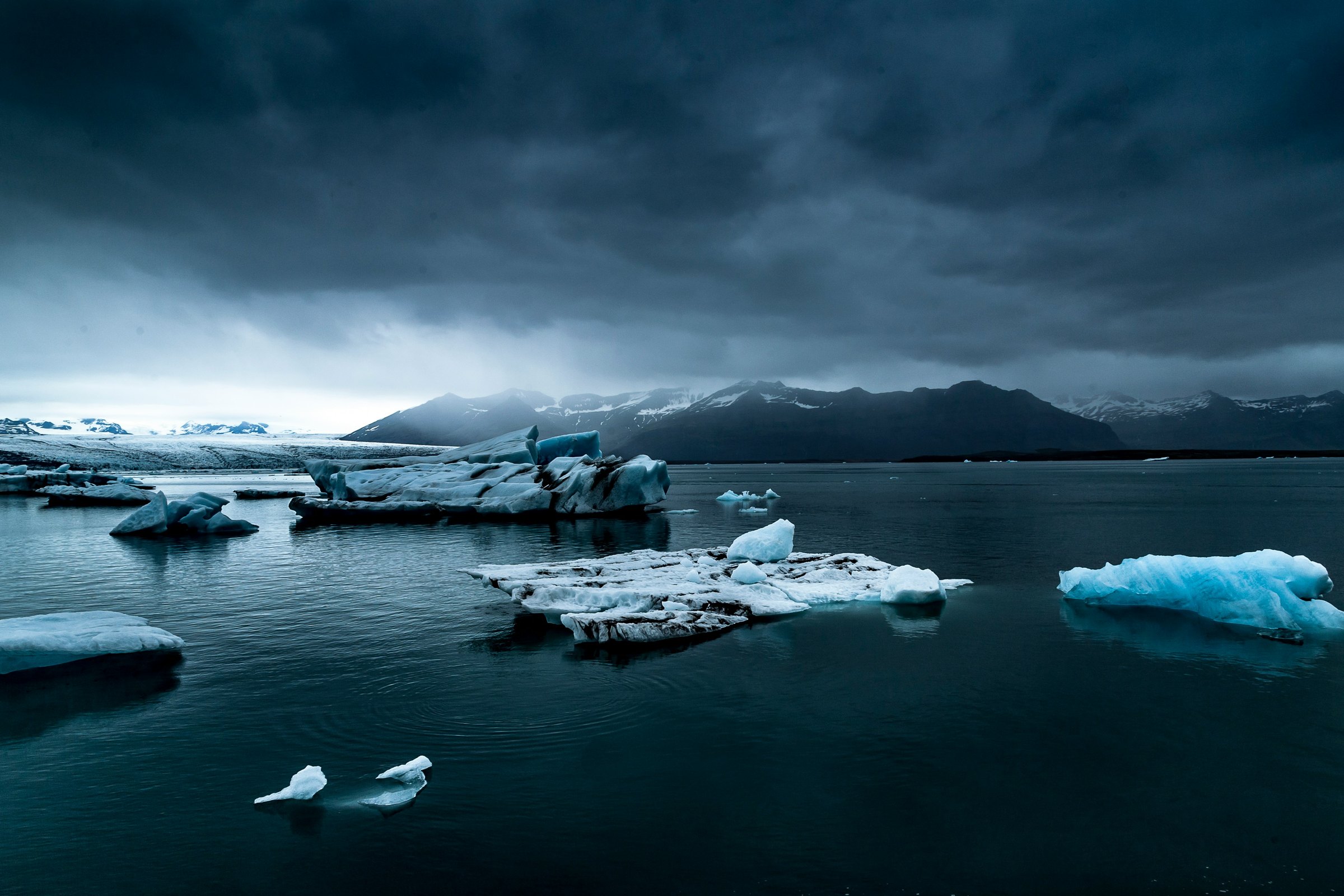 Dark glacier lagoon in Iceland at low light